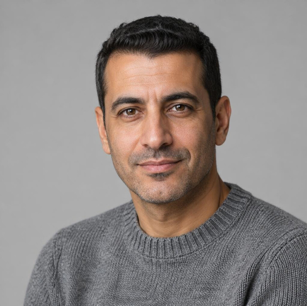 Portrait of a man with glasses and a calm expression